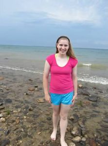 Julia standing on the beach